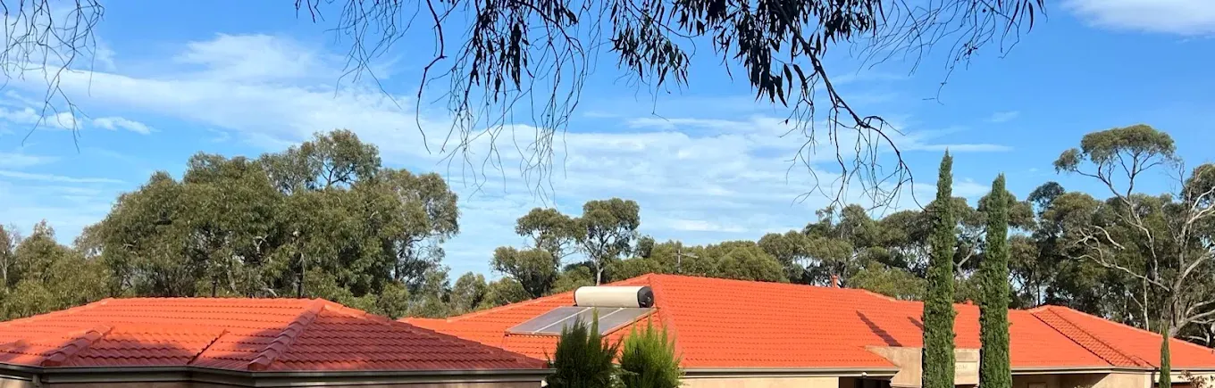 Completed terracotta roof restoration by Hume Roofing